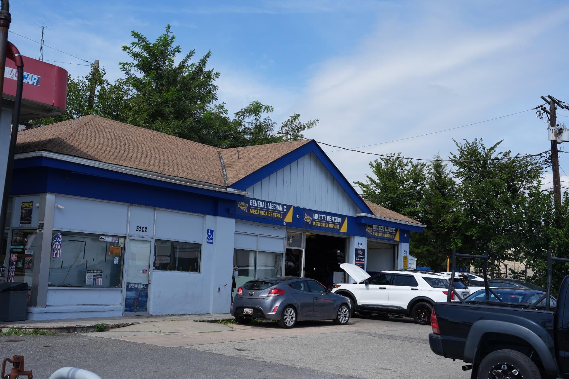 Diaz Auto Clinic garage bays at 5803 Annapolis Rd in Bladensburg, Maryland, with Maryland State Inspection signage